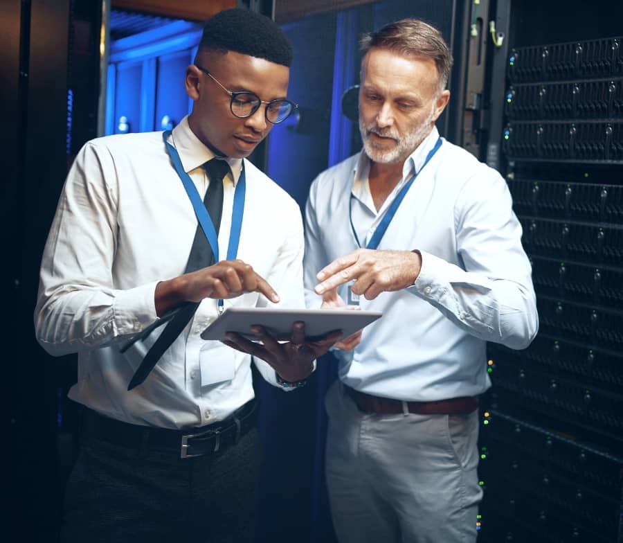 Acutest employees work on a project in a data centre